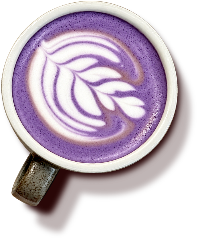 A violet latte with white leaf latte art